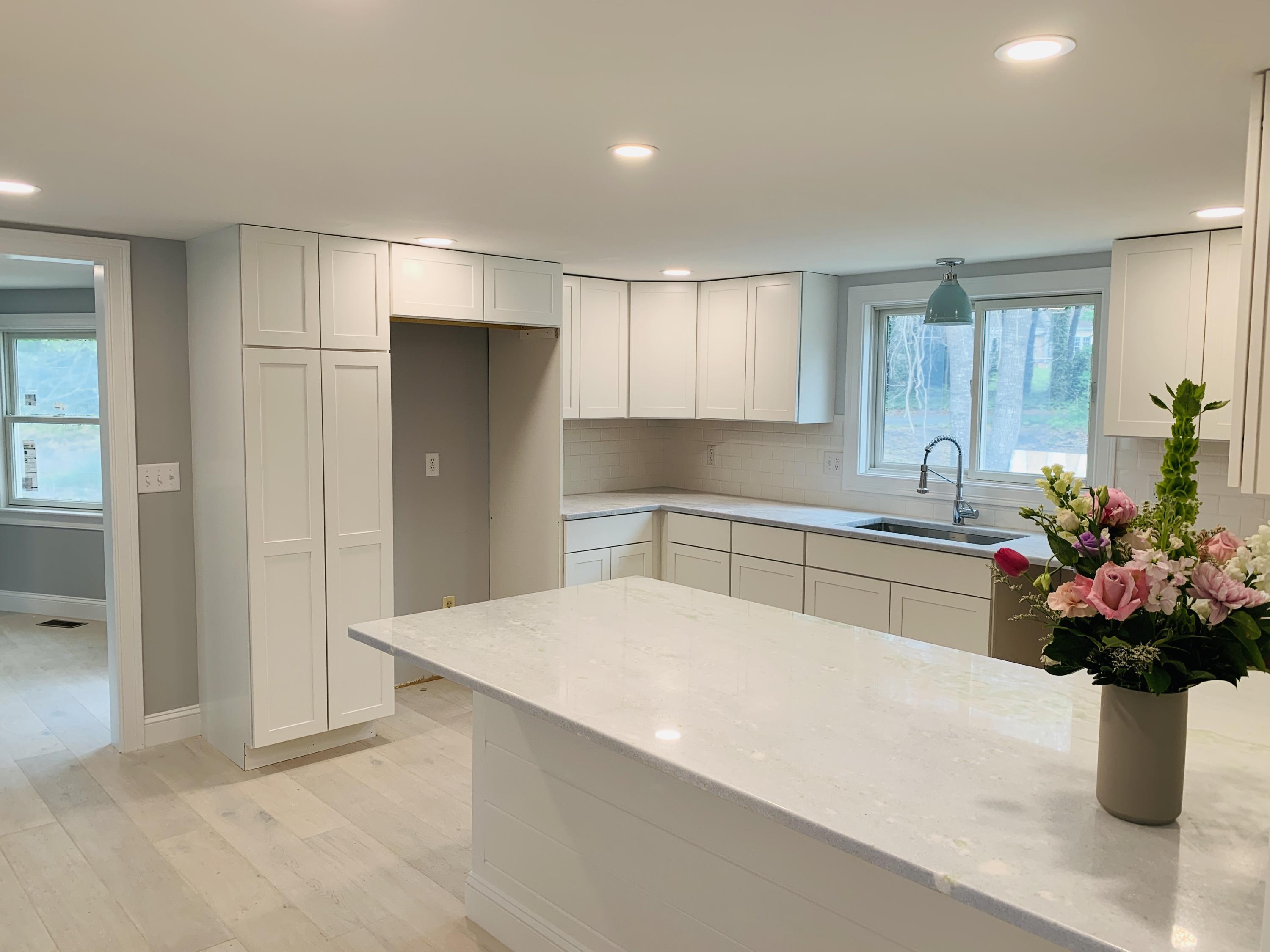 152 Barley Neck Road Orleans, MA 02653 - Photo 5 of 16 a kitchen with a refrigerator and a white cabinets
