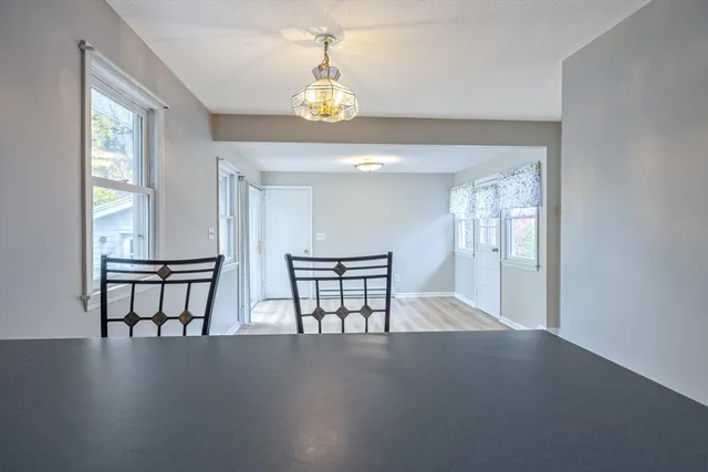 a view of hall way with furniture