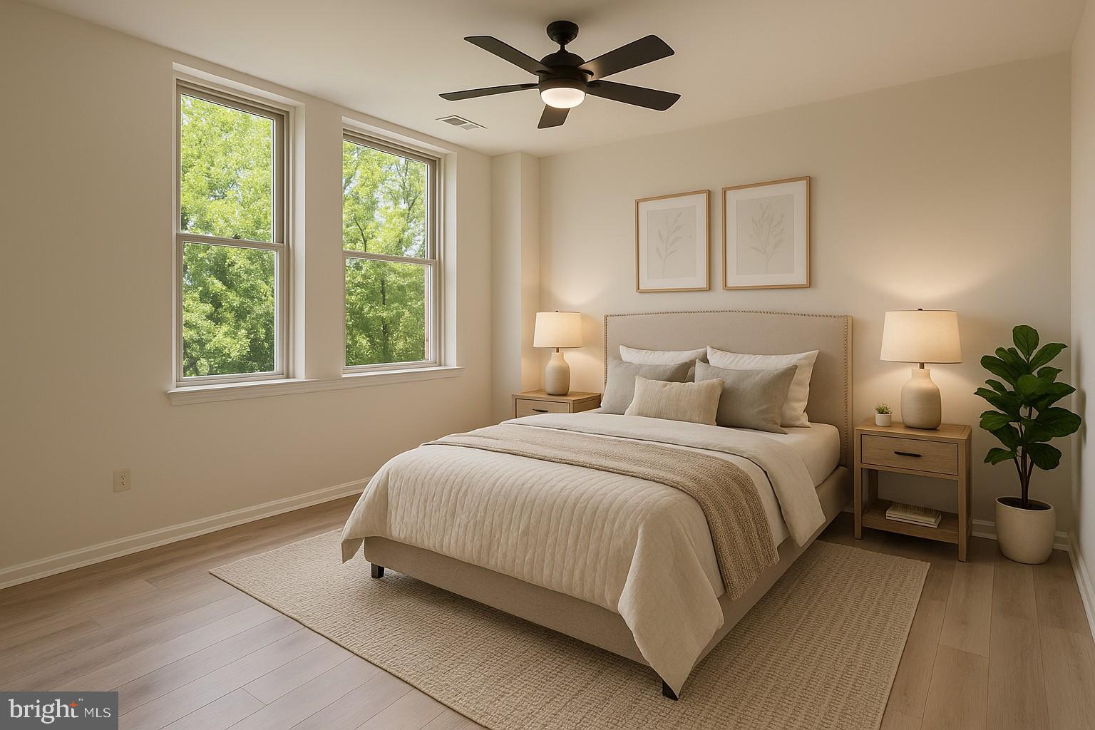 1218 Perry Street Northeast, Unit 202 Washington, DC 20017 - Photo 4 of 6 a bedroom with a large bed and a window