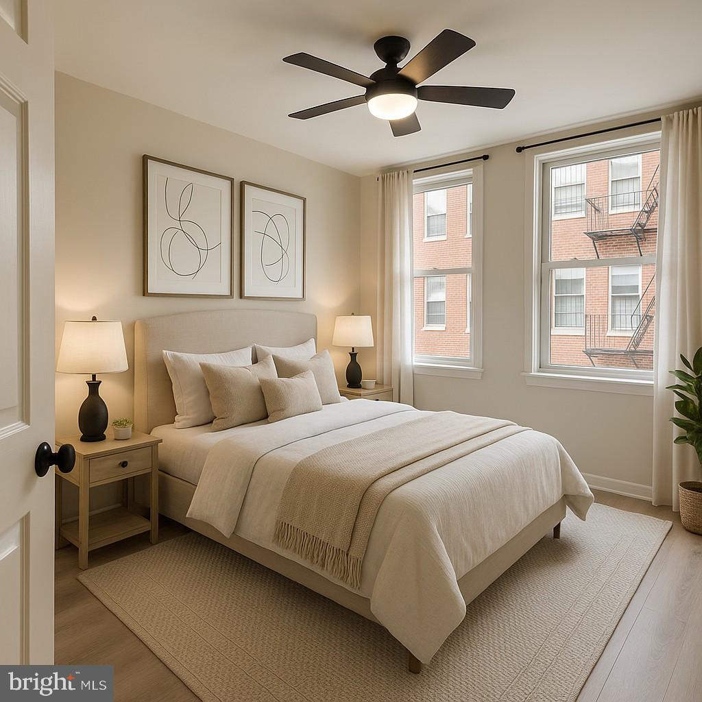 1218 Perry Street Northeast, Unit 202 Washington, DC 20017 - Photo 5 of 6 a bedroom with a large bed and a window