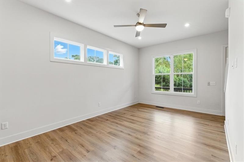 170 Color Circle Atlanta, GA 30317 - Photo 4 of 34 a view of an empty room with wooden floor and a window