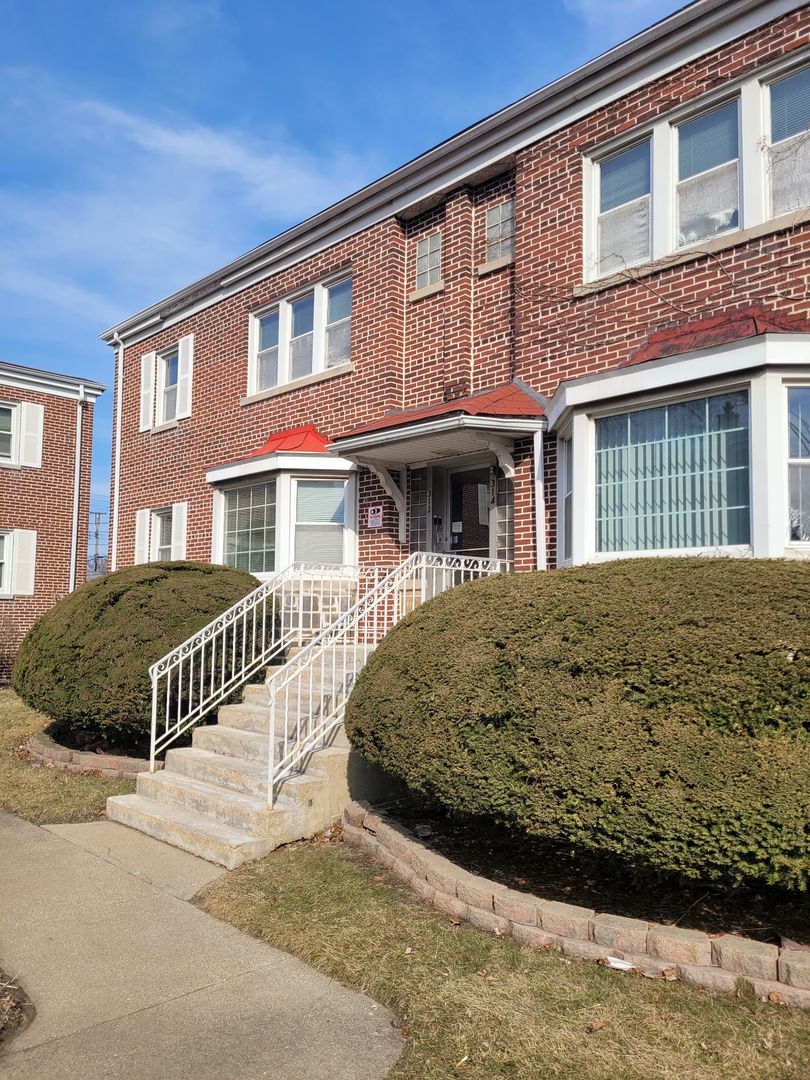 312 East 83rd Street, Unit 1 Chicago, IL 60619 - Photo 1 of 18 a front view of a building