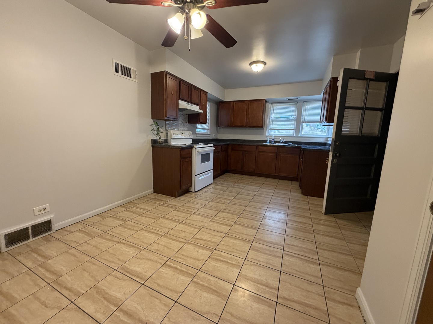 312 East 83rd Street, Unit 1 Chicago, IL 60619 - Photo 13 of 18 a kitchen with stainless steel appliances a refrigerator and a counter top space