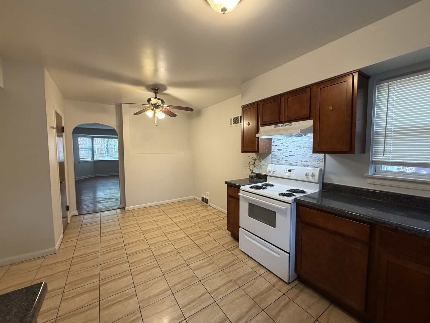 312 East 83rd Street, Unit 1 Chicago, IL 60619 - Photo 10 of 18 a kitchen with a stove cabinets and a sink