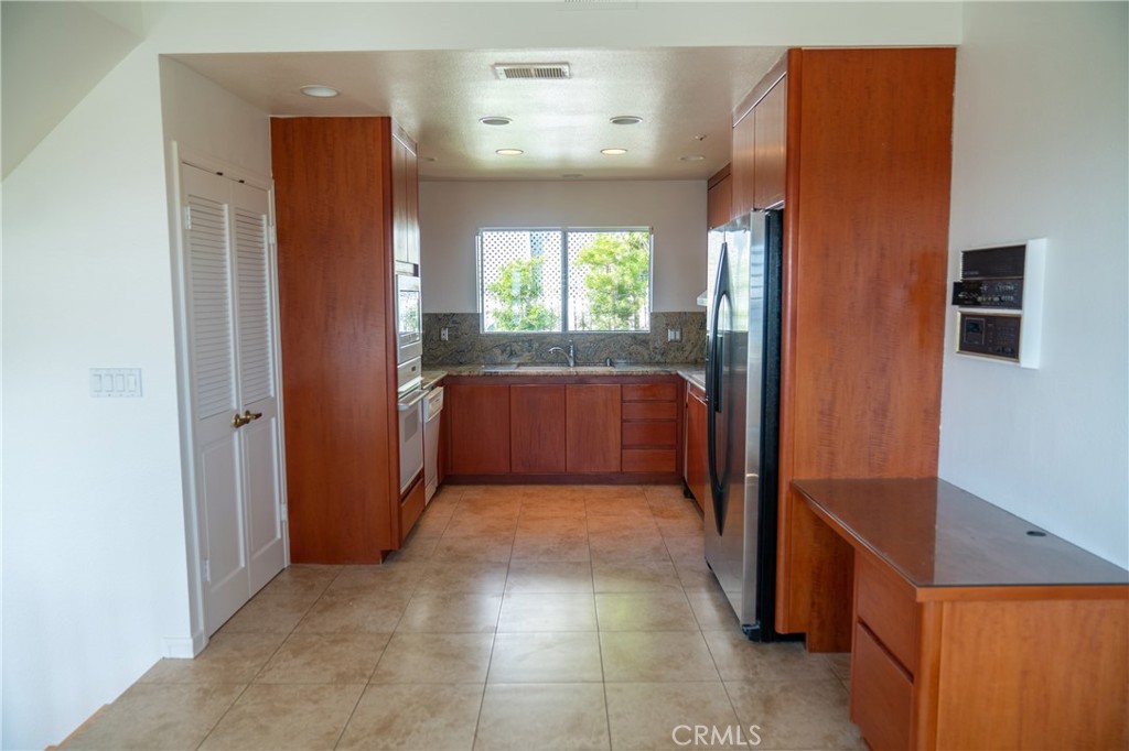 128 Avenida Trieste San Clemente, CA 92672 - Photo 4 of 14 a view of entryway with kitchen