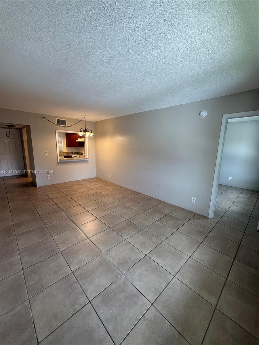 6841 Pembroke Road, Unit 15 Pembroke Pines, FL 33023 - Photo 2 of 16 a view of a livingroom and a window