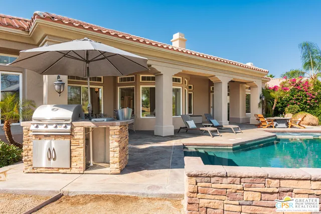 a view of a house with backyard porch and patio