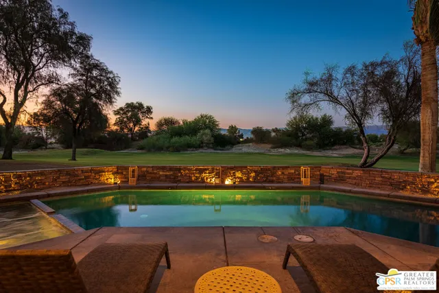 a view of swimming pool with seating