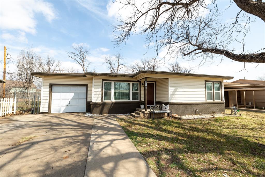 3205 42nd Street Snyder, TX 79549 - Photo 1 of 31 a front view of a house with a yard
