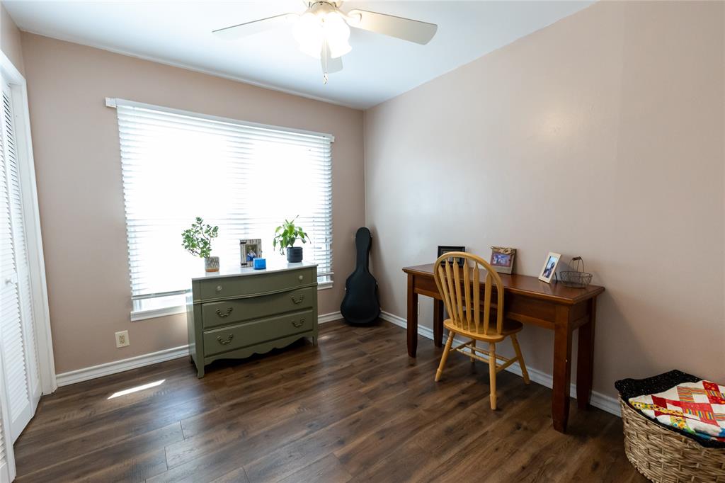 3205 42nd Street Snyder, TX 79549 - Photo 14 of 31 a view of a workspace with furniture and a window