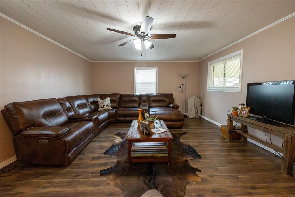 3205 42nd Street Snyder, TX 79549 - Photo 20 of 31 a living room with furniture and a flat screen tv