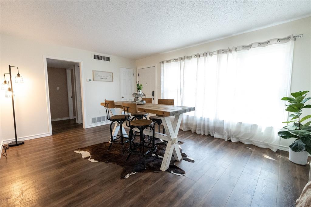 3205 42nd Street Snyder, TX 79549 - Photo 2 of 31 a view of a dining room with furniture and wooden floor
