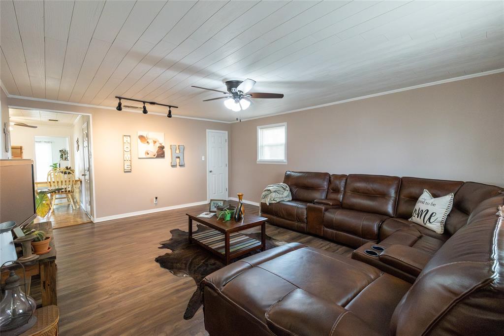 3205 42nd Street Snyder, TX 79549 - Photo 21 of 31 a living room with furniture and wooden floor