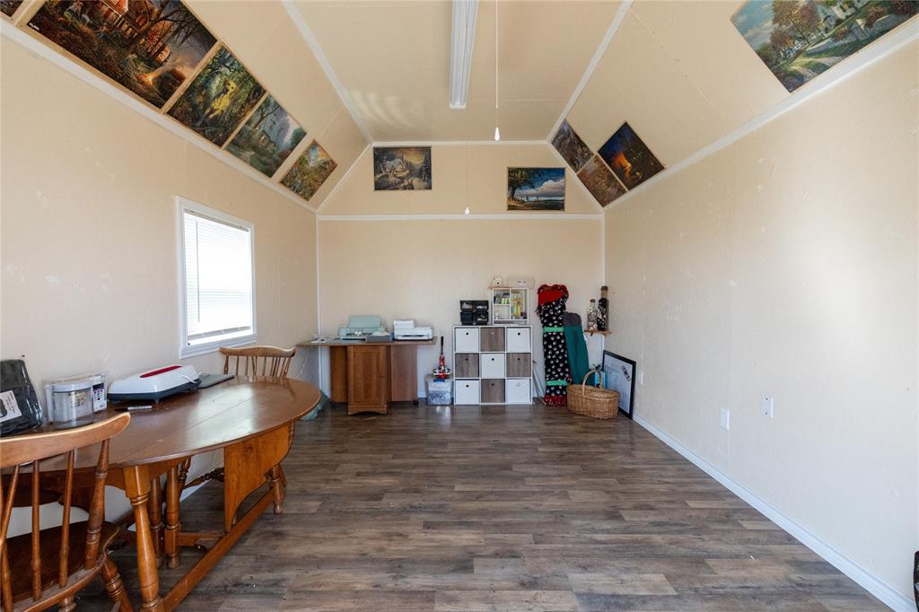3205 42nd Street Snyder, TX 79549 - Photo 25 of 31 a living room with furniture and a wooden floor