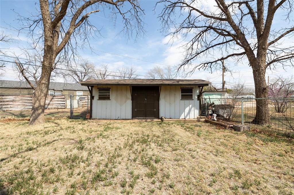 3205 42nd Street Snyder, TX 79549 - Photo 27 of 31 a view of a house with large trees