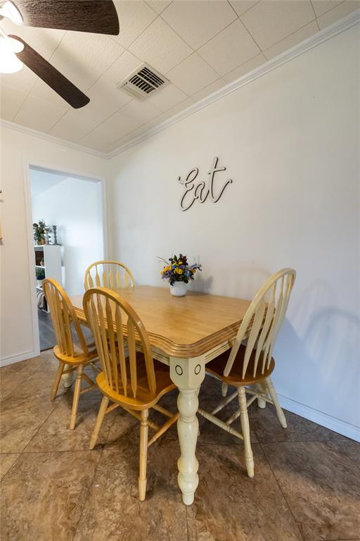 3205 42nd Street Snyder, TX 79549 - Photo 10 of 31 a dining room with furniture and window