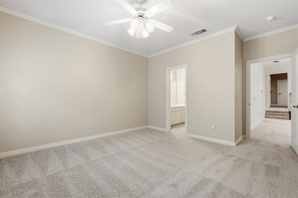 970 Crystal Cove Oak Point, TX 75068 - Photo 28 of 40 an empty room with closet and a chandelier fan