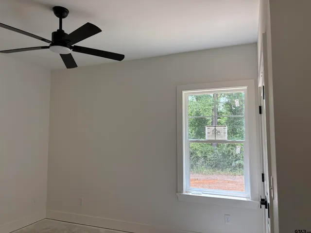 en a white room with a window