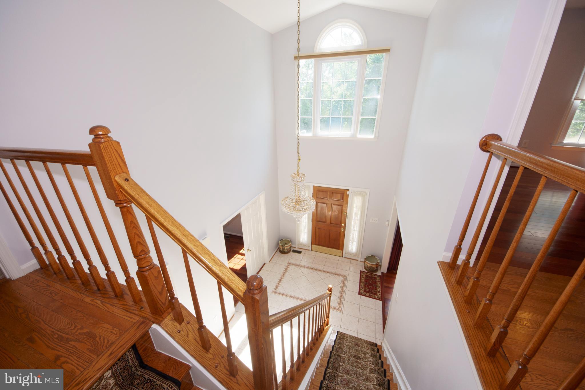 13905 North Gate Lane Silver Spring, MD 20906 - Photo 20 of 23 View of foyer from upper level corridor.