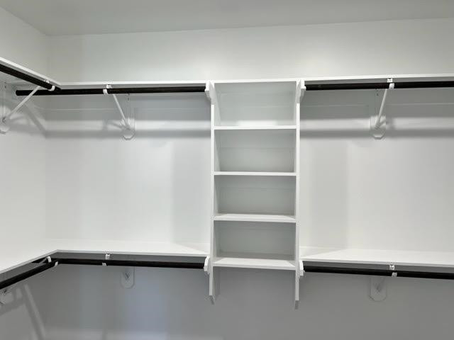 122 Olive Br Drive Smithfield, NC 27577 - Photo 16 of 23 a view of walk in closet with empty racks