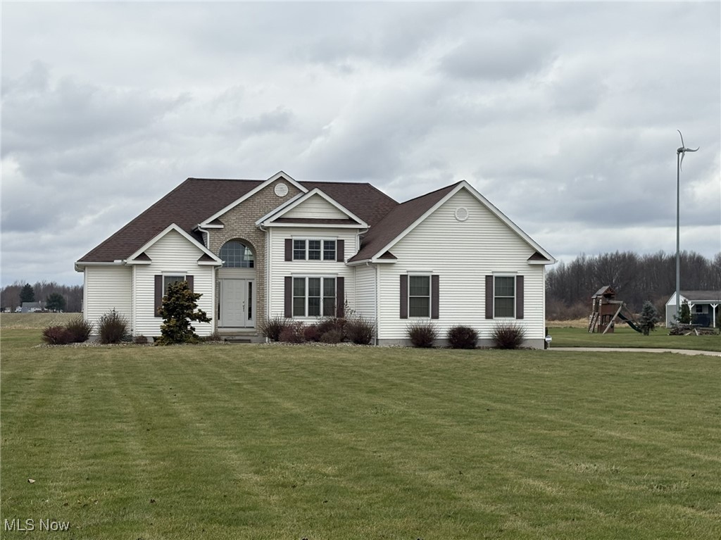 9260 Fowl Road Elyria, OH 44035 - Photo 16 of 25 View of front of house with a front yard