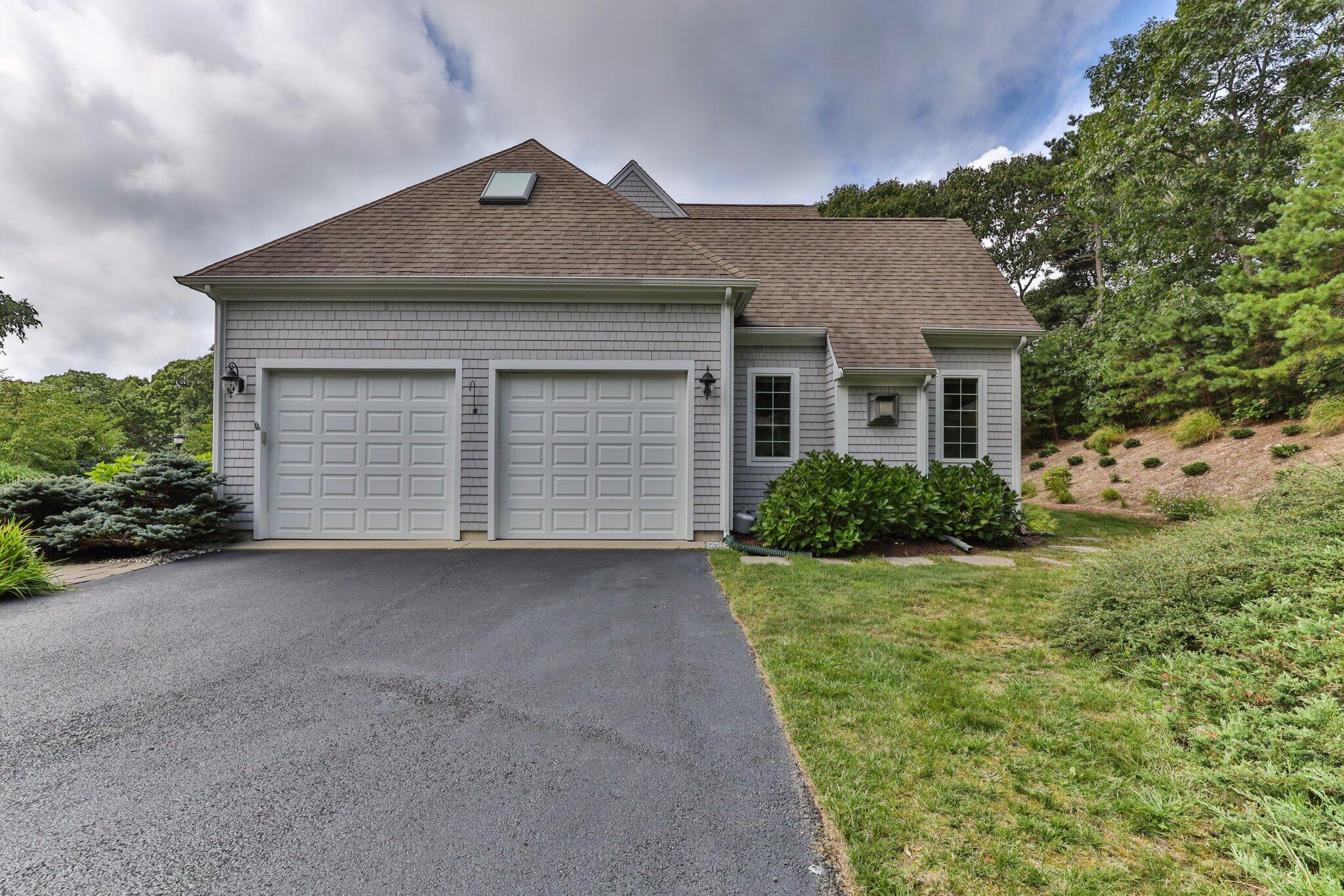 137 Cairn Ridge Road East Falmouth, MA 02536 - Photo 46 of 70 front view of a house with a yard
