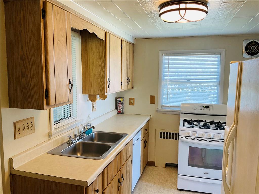135 Constitution Circle Clairton, PA 15025 - Photo 12 of 40 a kitchen that has a sink and a stove