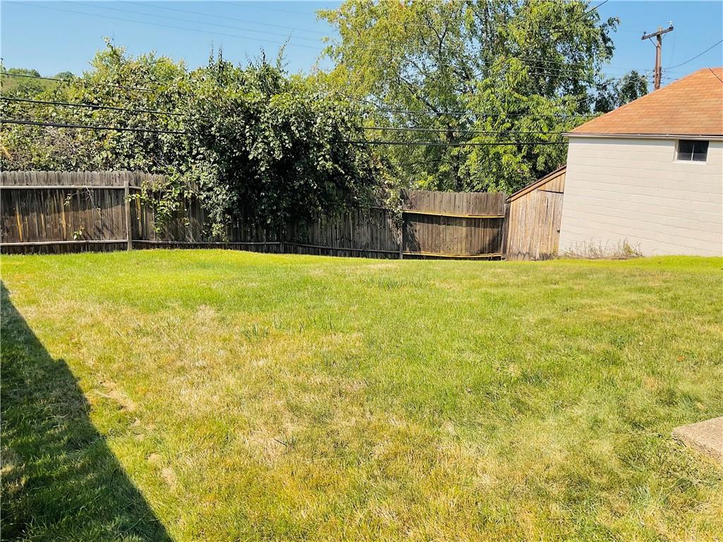 135 Constitution Circle Clairton, PA 15025 - Photo 33 of 40 a view of a back yard of the house with a large tree