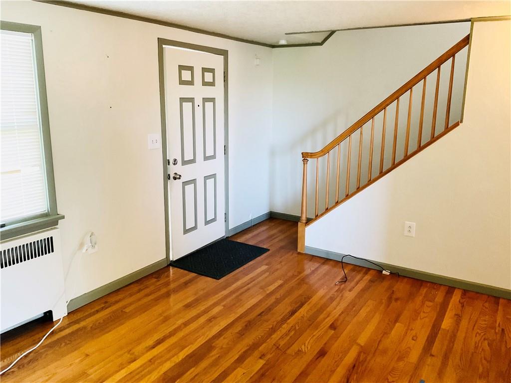 135 Constitution Circle Clairton, PA 15025 - Photo 4 of 40 a view of an empty room with wooden floor