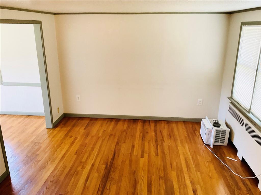 135 Constitution Circle Clairton, PA 15025 - Photo 6 of 40 a view of a room with wooden floor and gate