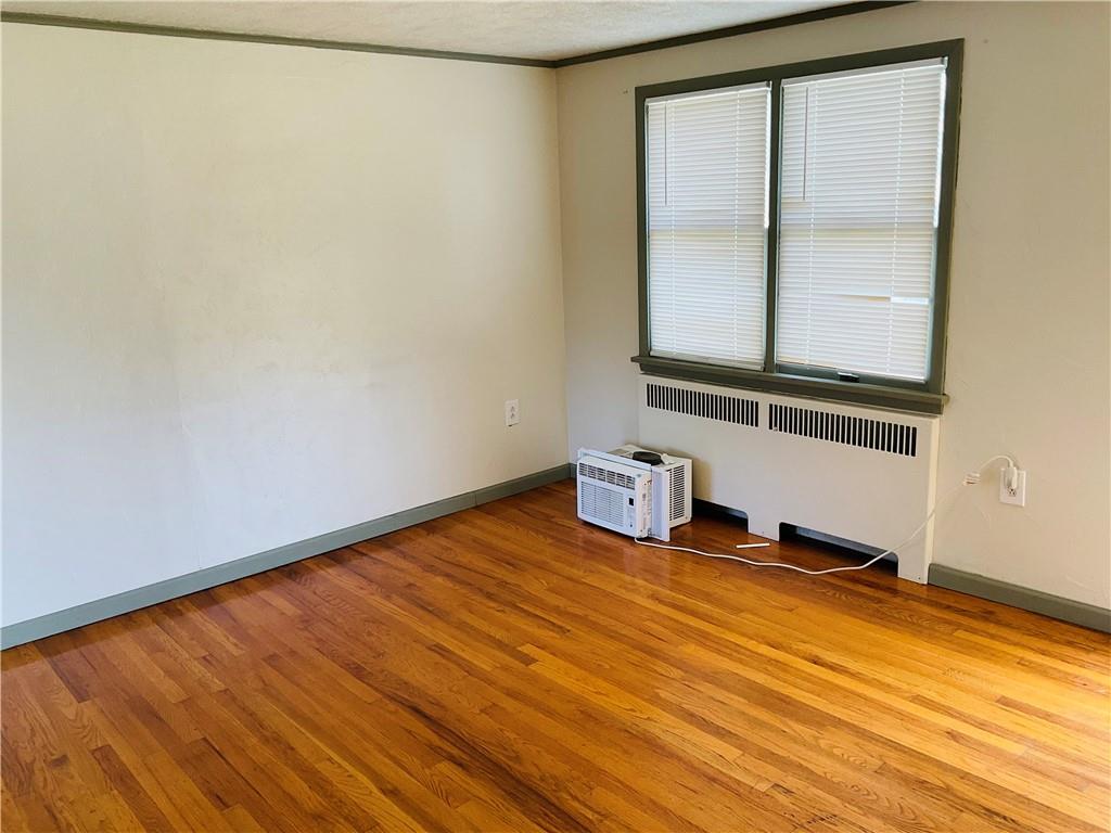 135 Constitution Circle Clairton, PA 15025 - Photo 7 of 40 a view of a room with wooden floor and small window