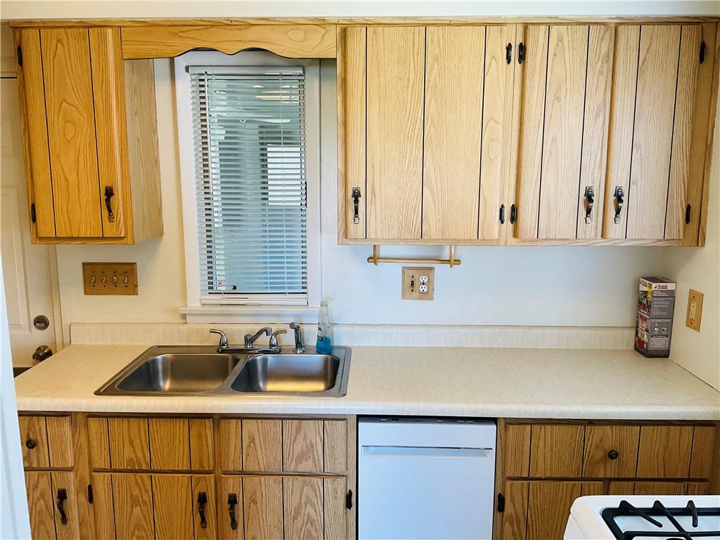 135 Constitution Circle Clairton, PA 15025 - Photo 9 of 40 a kitchen with a sink cabinets and window