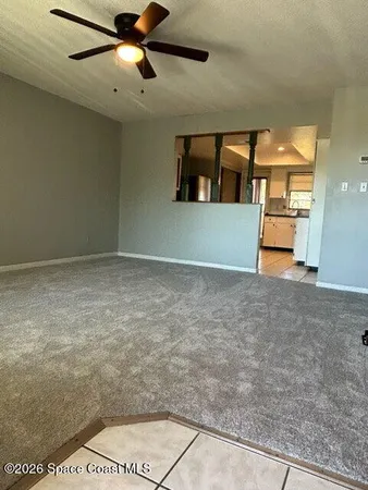 a view of a livingroom with a ceiling fan