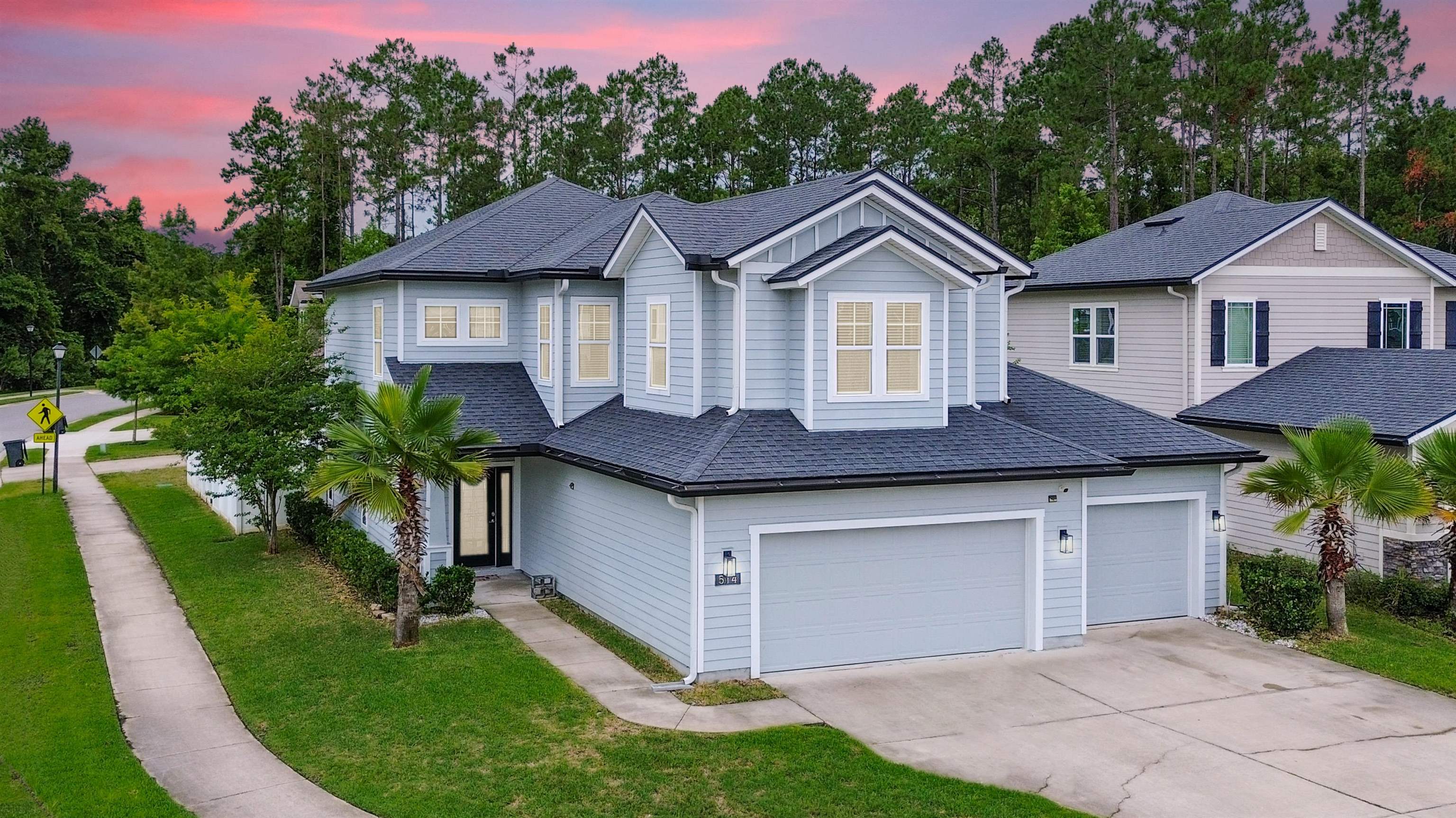 514 Heron Landing Road St. Johns, FL 32259 - Photo 1 of 48 a front view of a house with a yard and garage