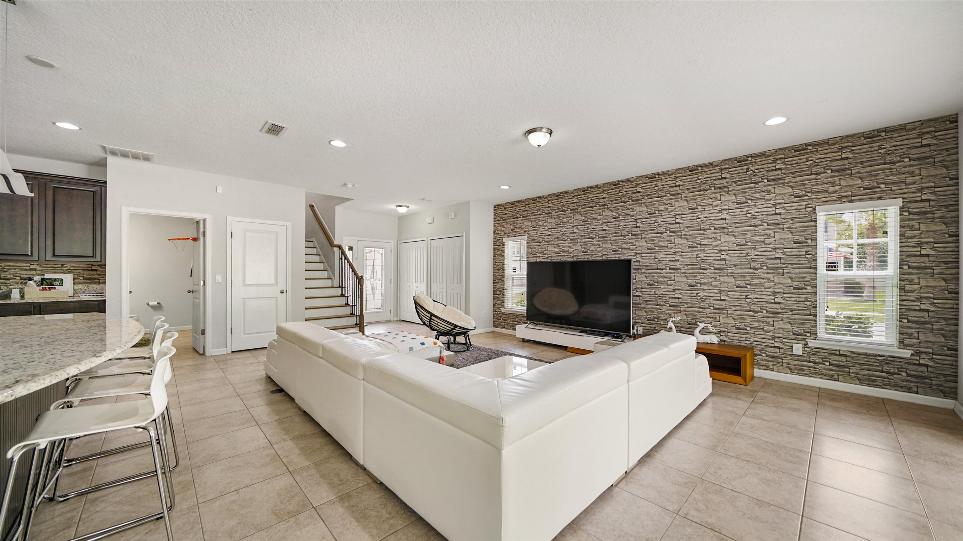 514 Heron Landing Road St. Johns, FL 32259 - Photo 12 of 48 a living room with furniture and a fireplace