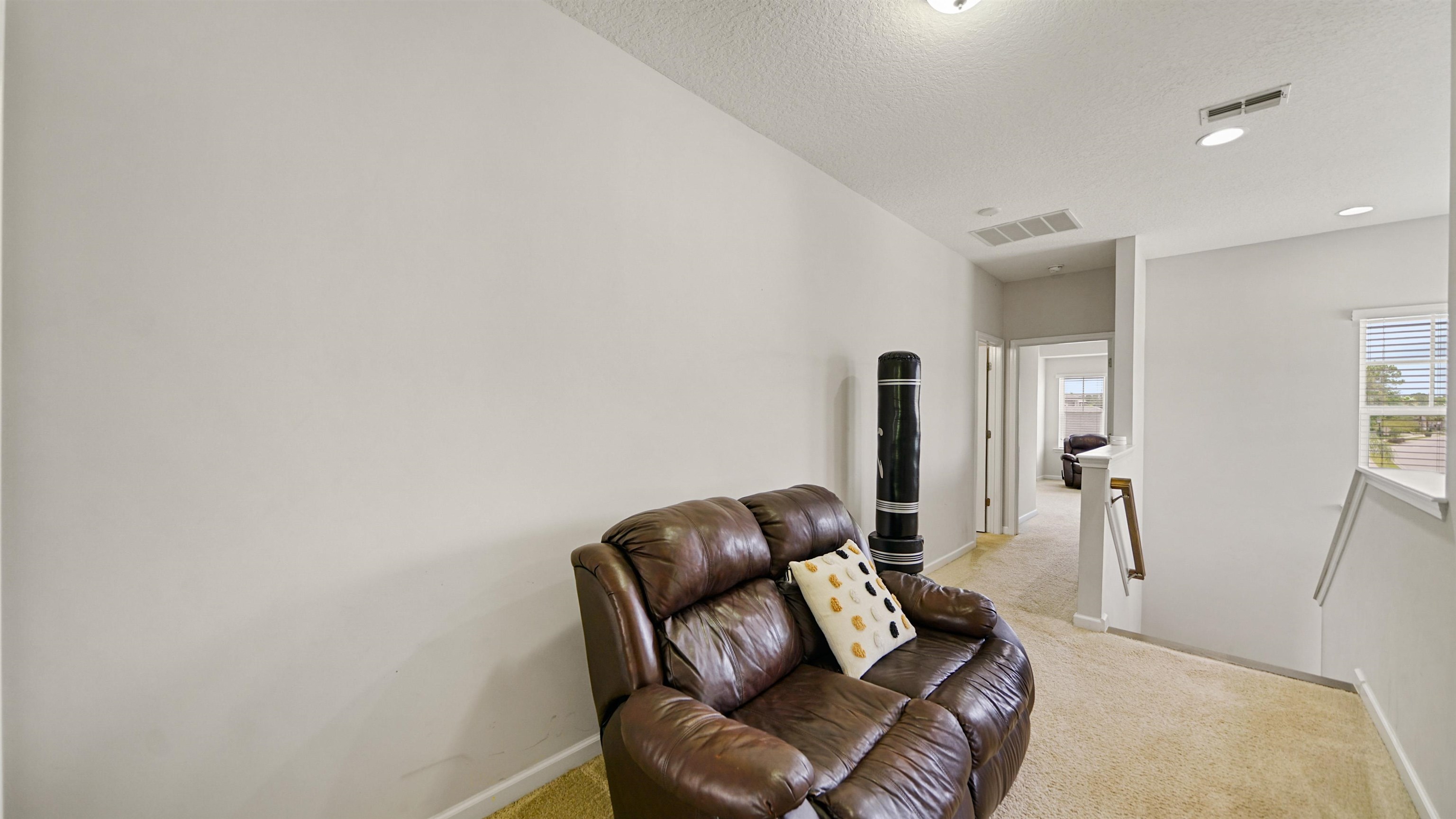 514 Heron Landing Road St. Johns, FL 32259 - Photo 19 of 48 a living room with furniture and a wooden floor
