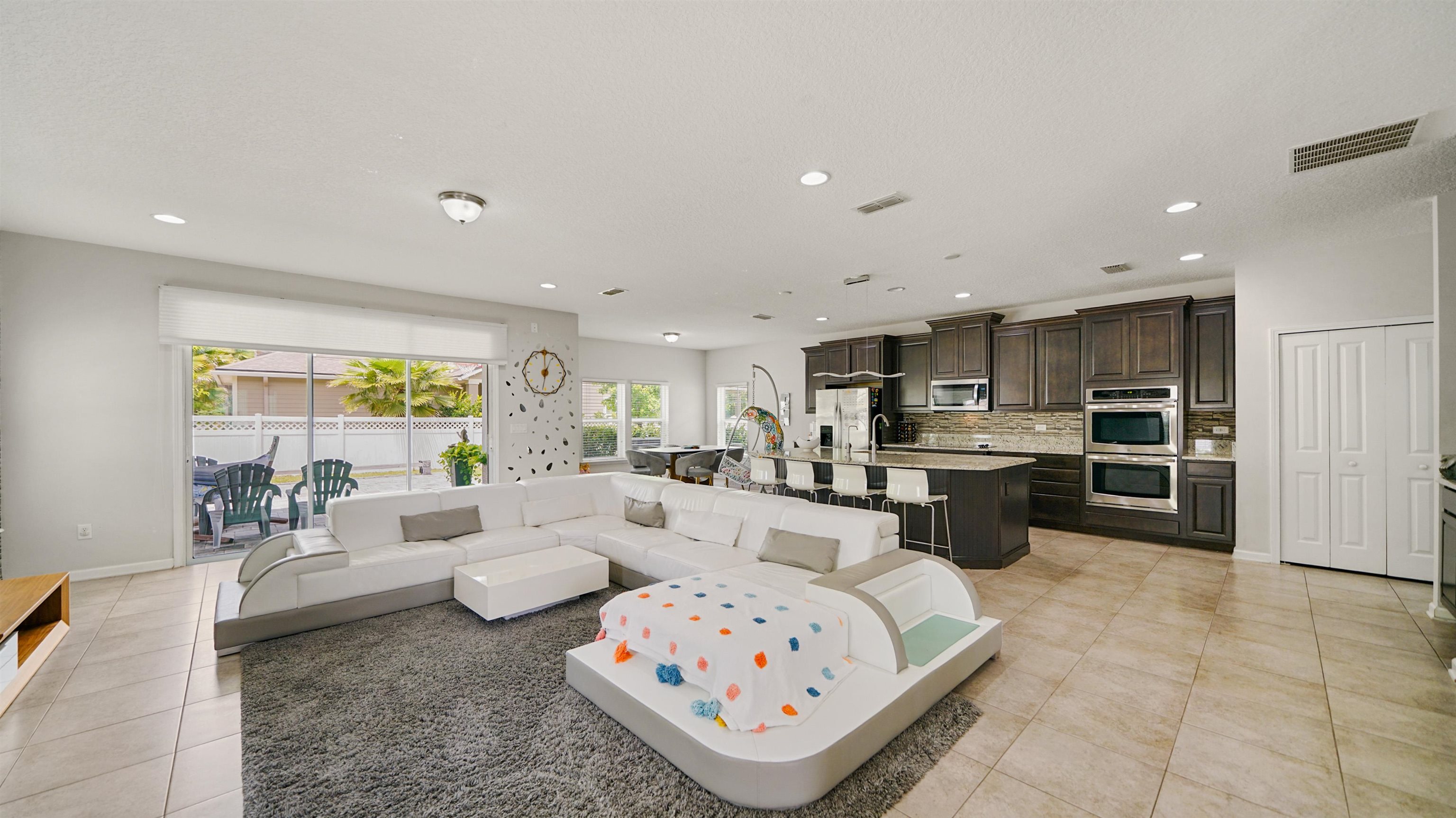 514 Heron Landing Road St. Johns, FL 32259 - Photo 2 of 48 a living room with furniture and a large window