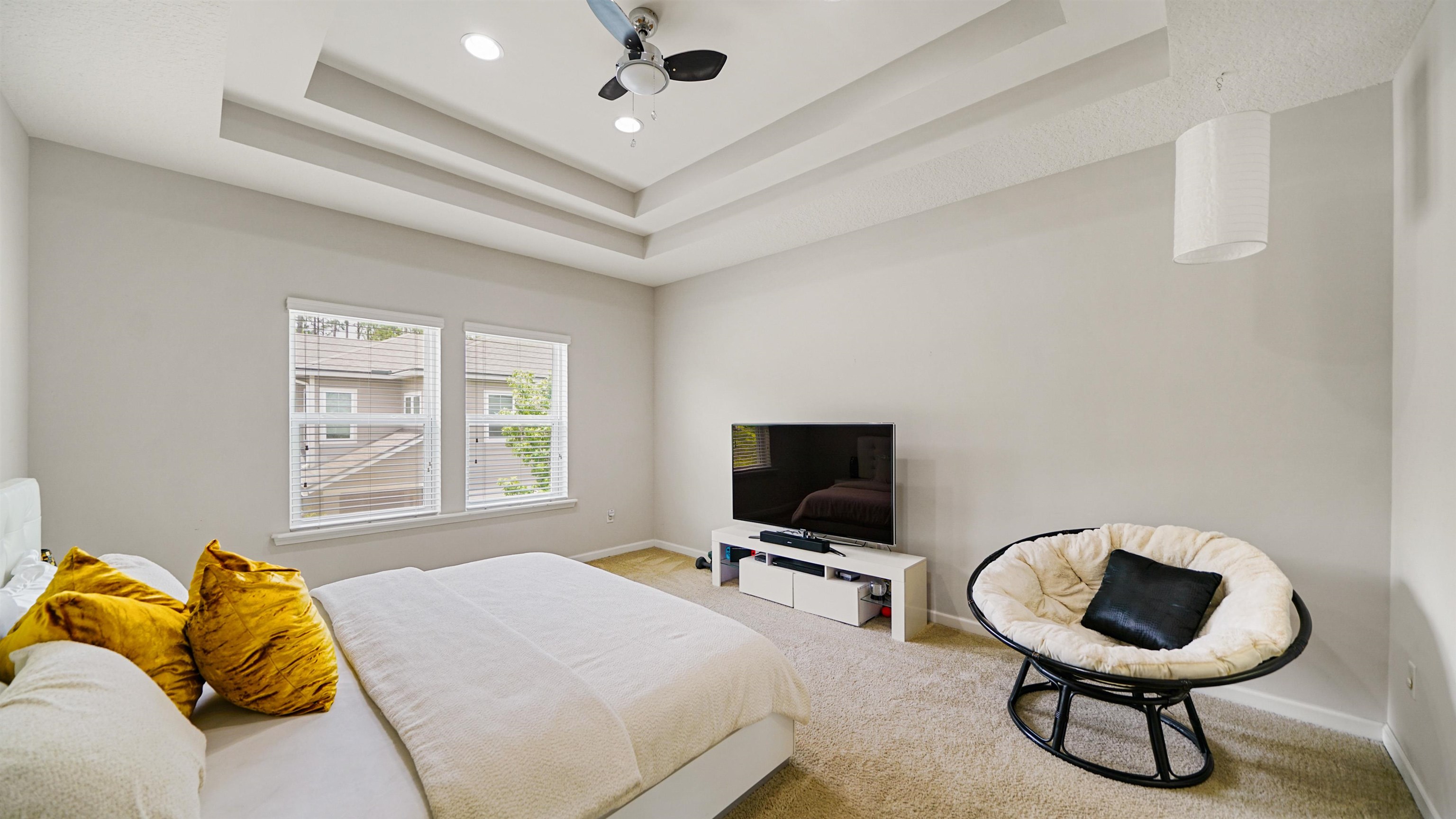 514 Heron Landing Road St. Johns, FL 32259 - Photo 21 of 48 a bedroom with a bed and a flat screen tv