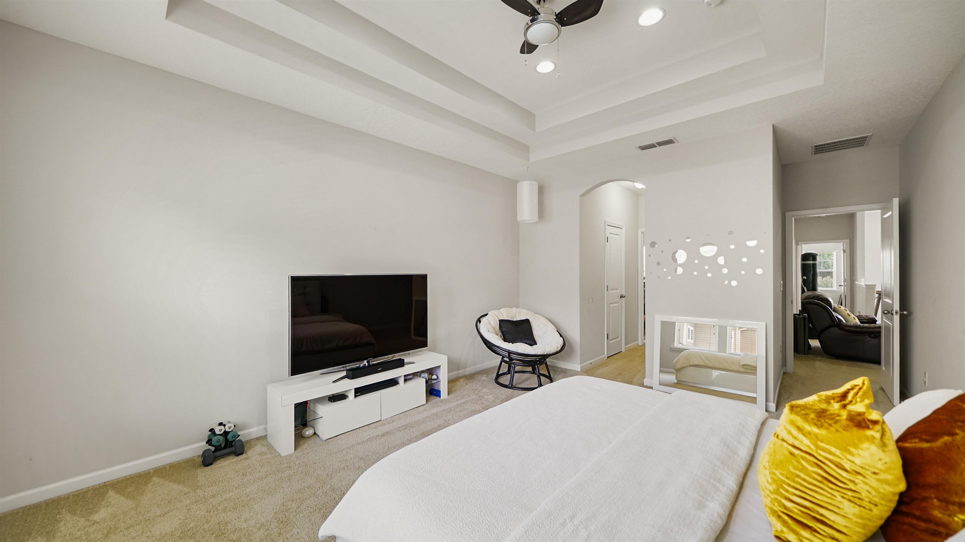 514 Heron Landing Road St. Johns, FL 32259 - Photo 22 of 48 a bedroom with a bed and a flat screen tv