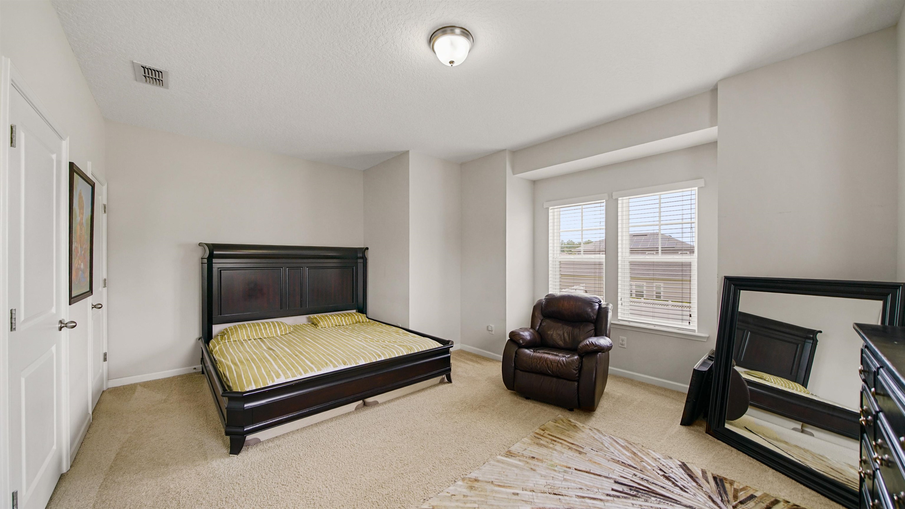 514 Heron Landing Road St. Johns, FL 32259 - Photo 26 of 48 a bedroom with a bed and a window