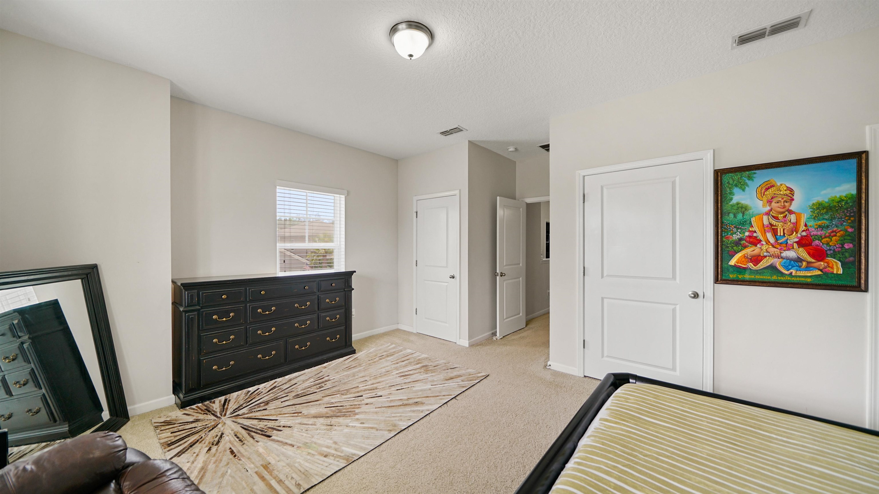 514 Heron Landing Road St. Johns, FL 32259 - Photo 27 of 48 a bedroom with a bed and a dresser