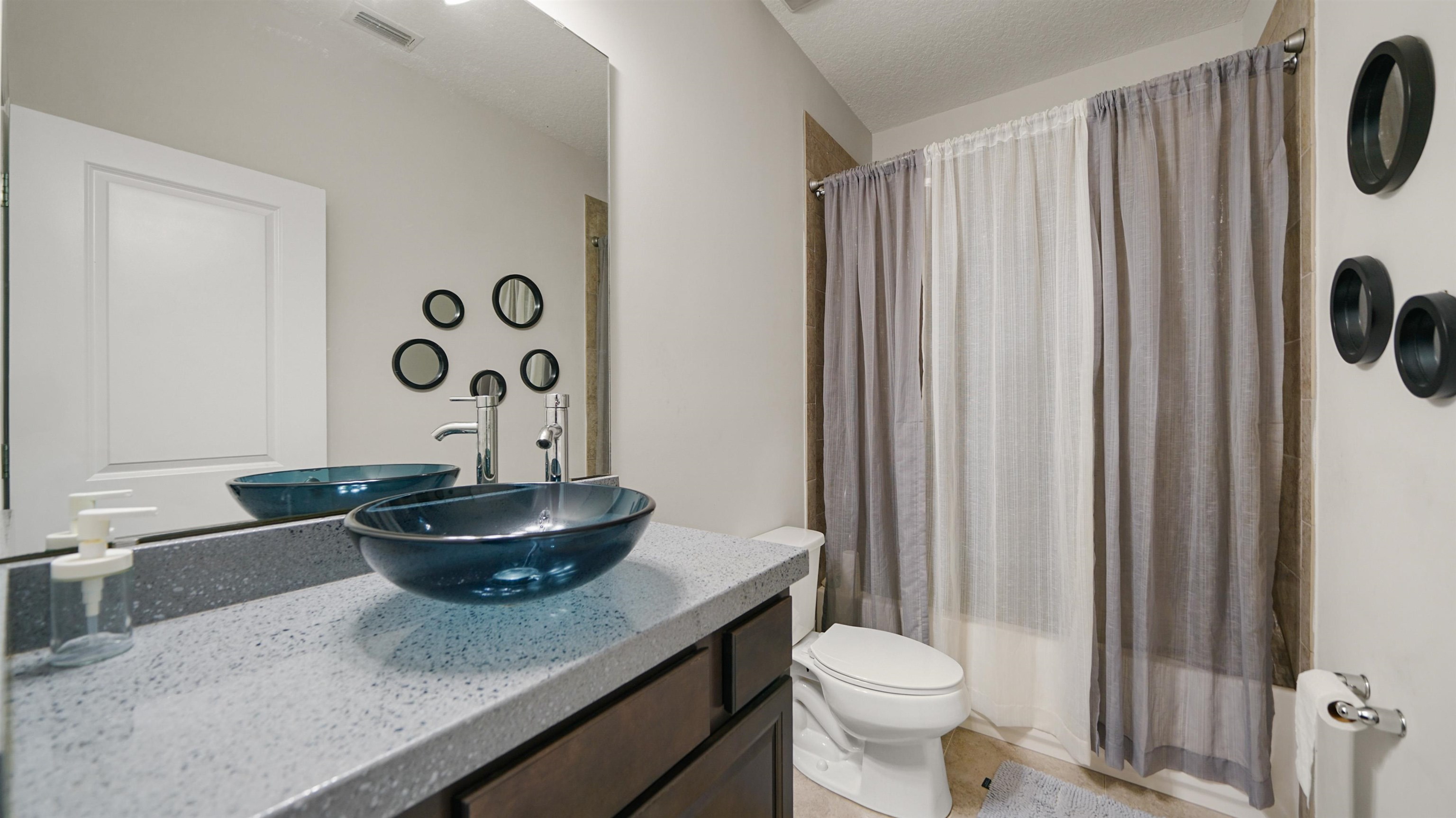 514 Heron Landing Road St. Johns, FL 32259 - Photo 28 of 48 a bathroom with a granite countertop sink and a toilet