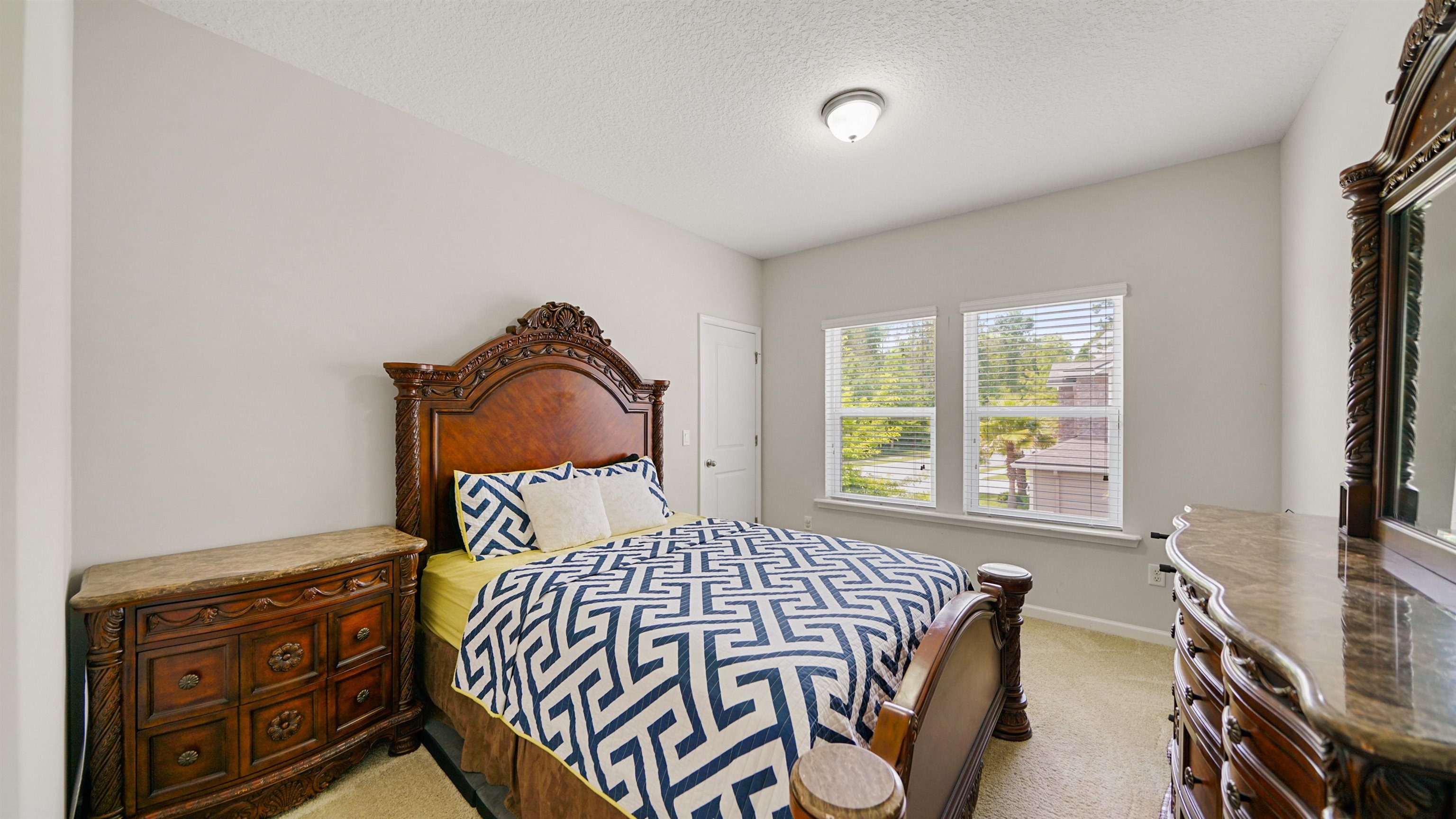 514 Heron Landing Road St. Johns, FL 32259 - Photo 29 of 48 a bedroom with a bed and a window