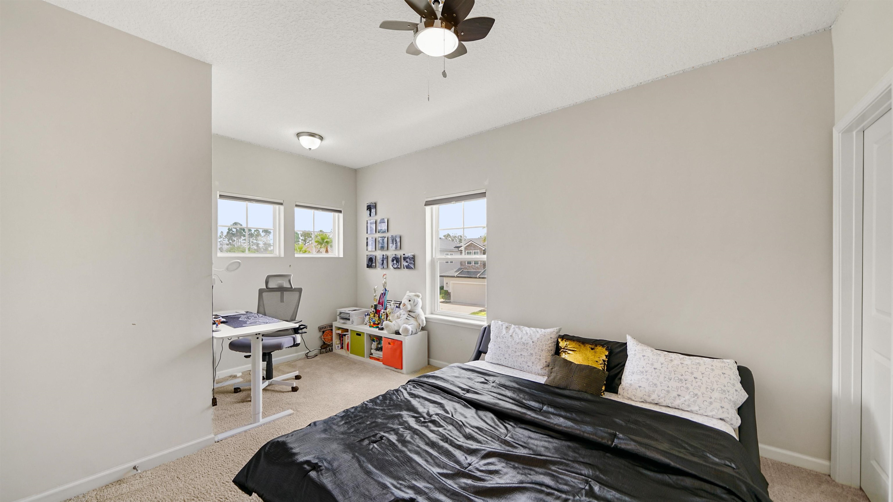 514 Heron Landing Road St. Johns, FL 32259 - Photo 30 of 48 a bed room with a bed and a window