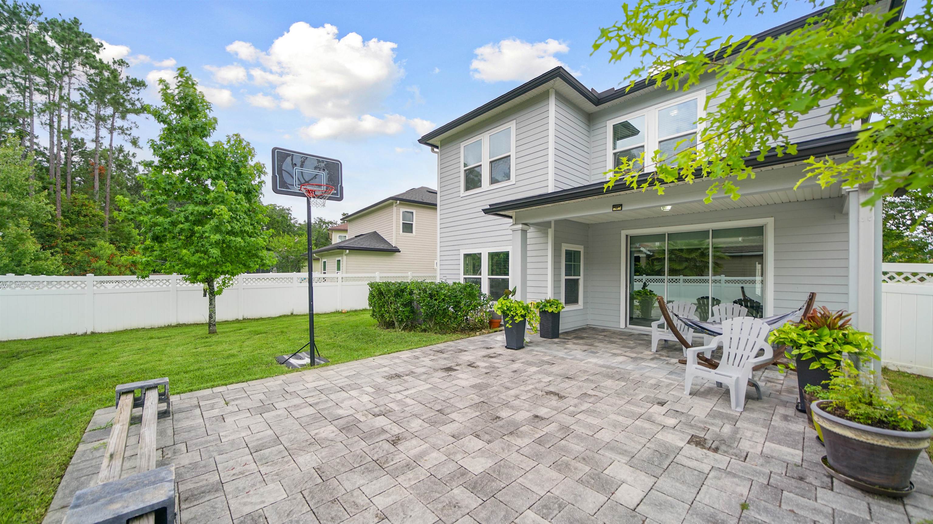 514 Heron Landing Road St. Johns, FL 32259 - Photo 33 of 48 a front view of a house with garden and porch