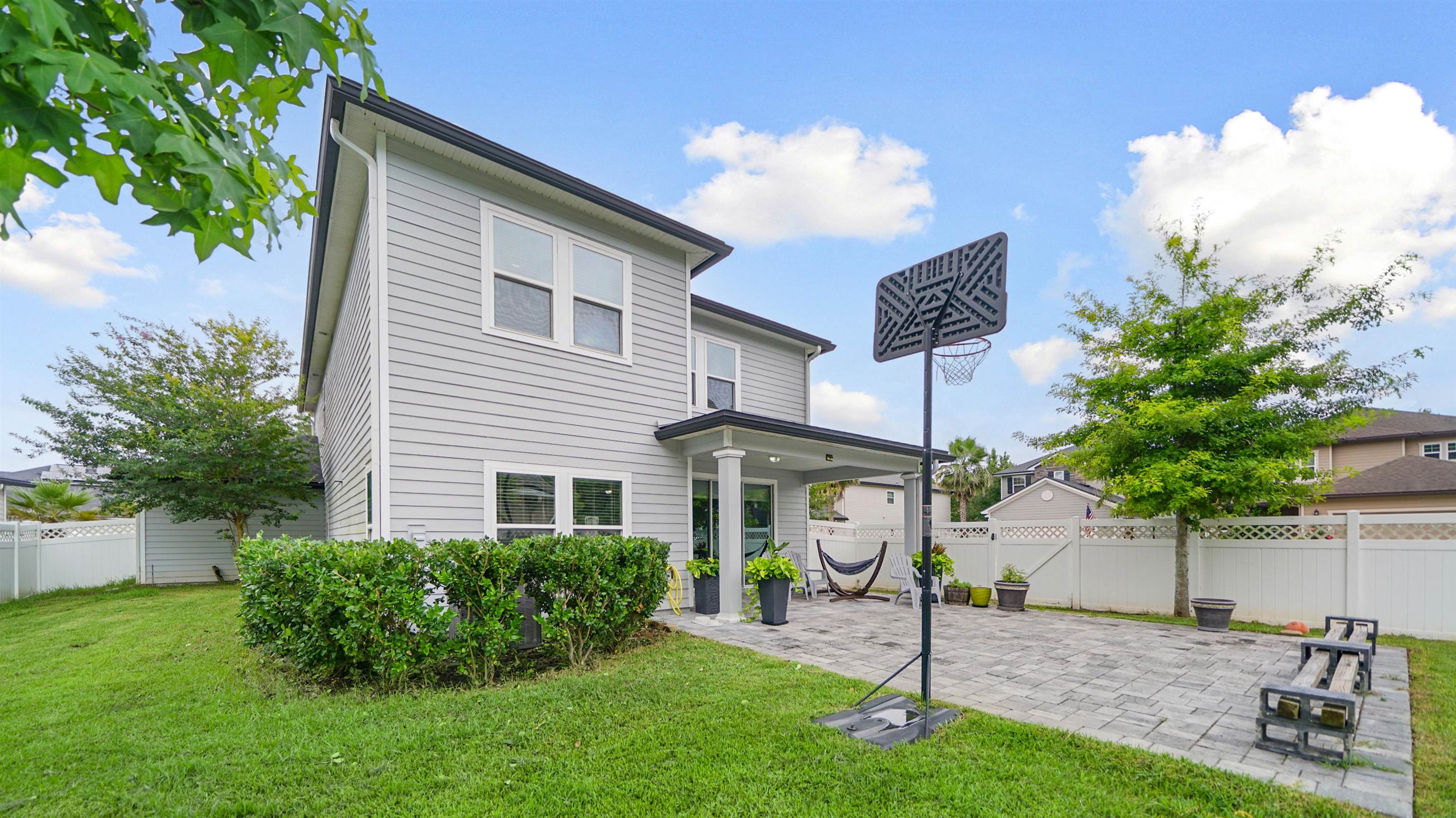 514 Heron Landing Road St. Johns, FL 32259 - Photo 35 of 48 a front view of a house with a garden and plants