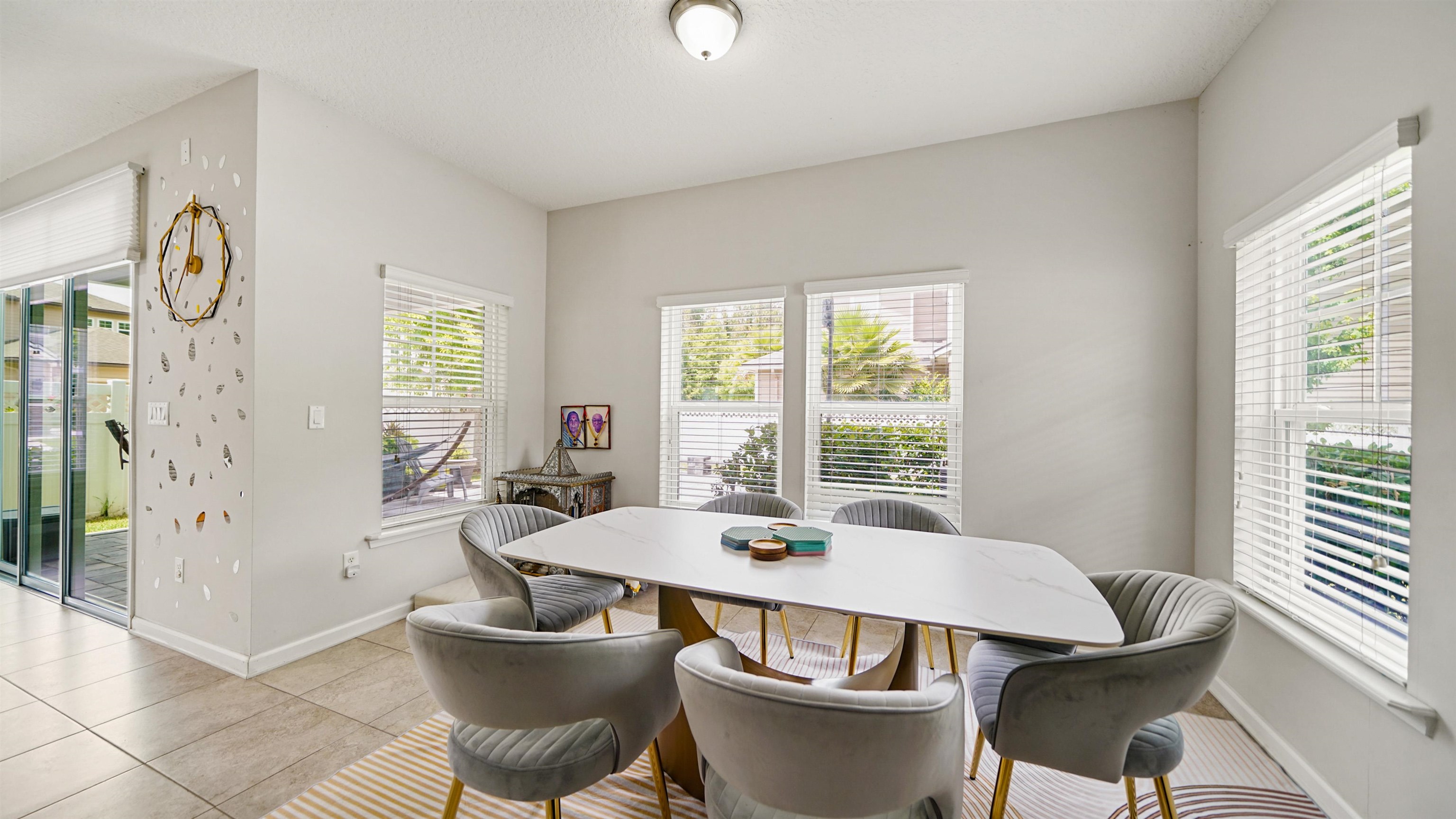 514 Heron Landing Road St. Johns, FL 32259 - Photo 4 of 48 a view of a dining room with furniture window and wooden floor