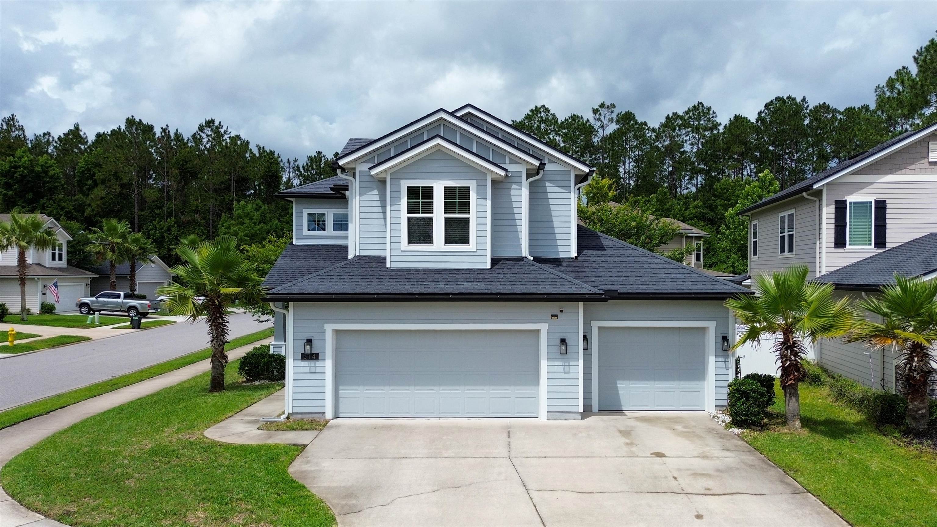 514 Heron Landing Road St. Johns, FL 32259 - Photo 42 of 48 a front view of a house with a yard and garage