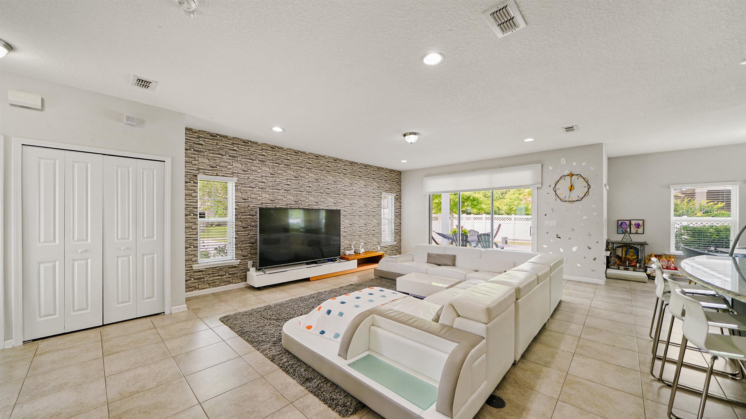 514 Heron Landing Road St. Johns, FL 32259 - Photo 5 of 48 a living room with furniture and a flat screen tv