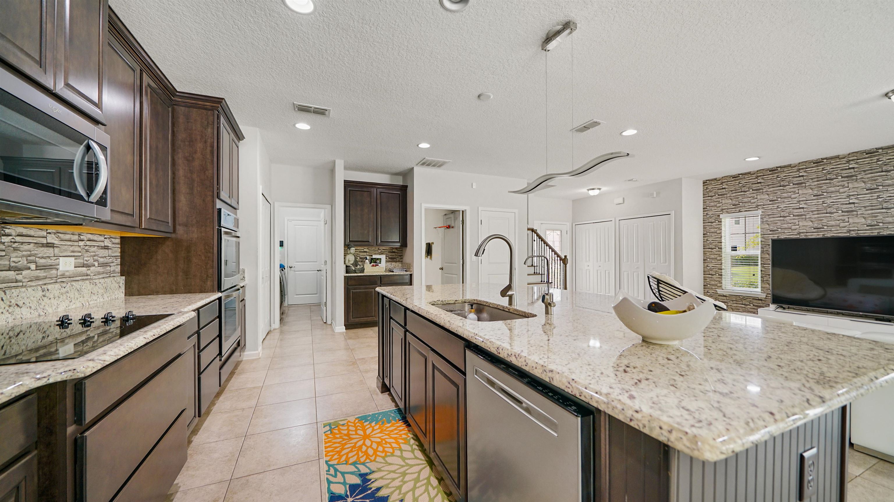 514 Heron Landing Road St. Johns, FL 32259 - Photo 8 of 48 a kitchen with sink stove top oven and microwave